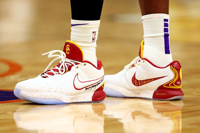 Los Angeles Lakers forward LeBron James' white, cardinal, and gold Nike sneakers.